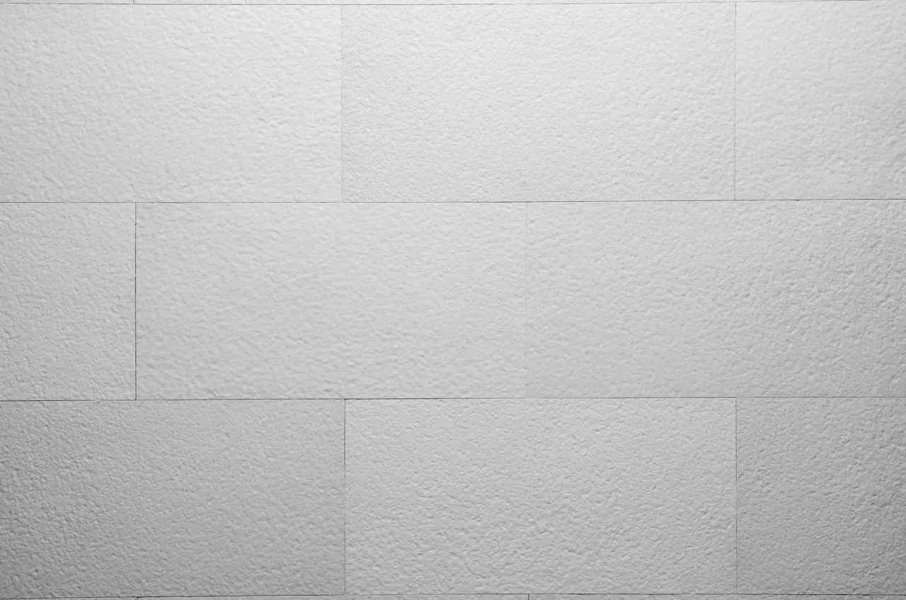 White B01 Butcher White flexible tiles with a fine bush-hammered texture laid with staggered joints