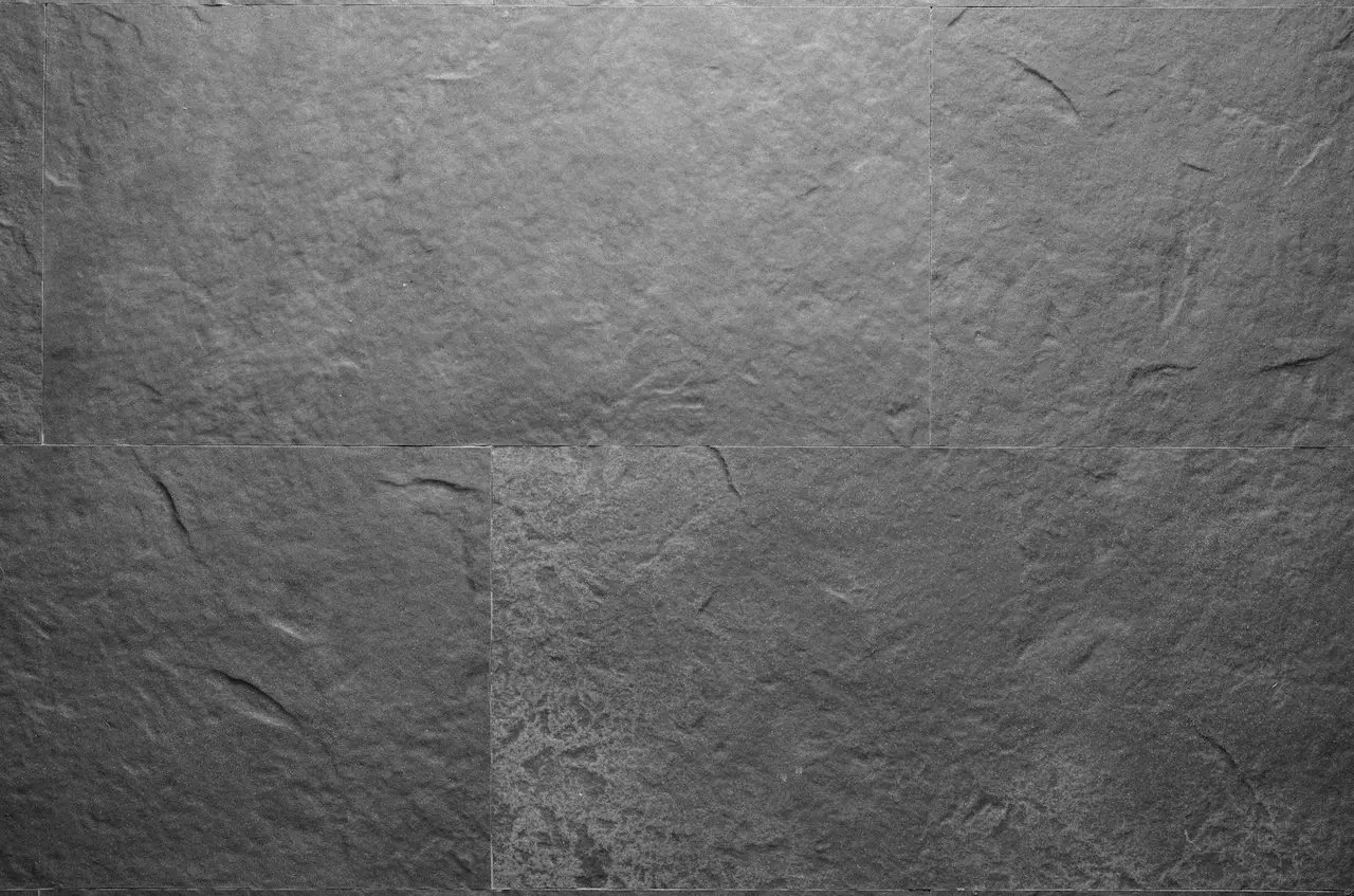 Grey R04 Cerro-Torre flexible tile with a natural stone relief and light mineral flecks