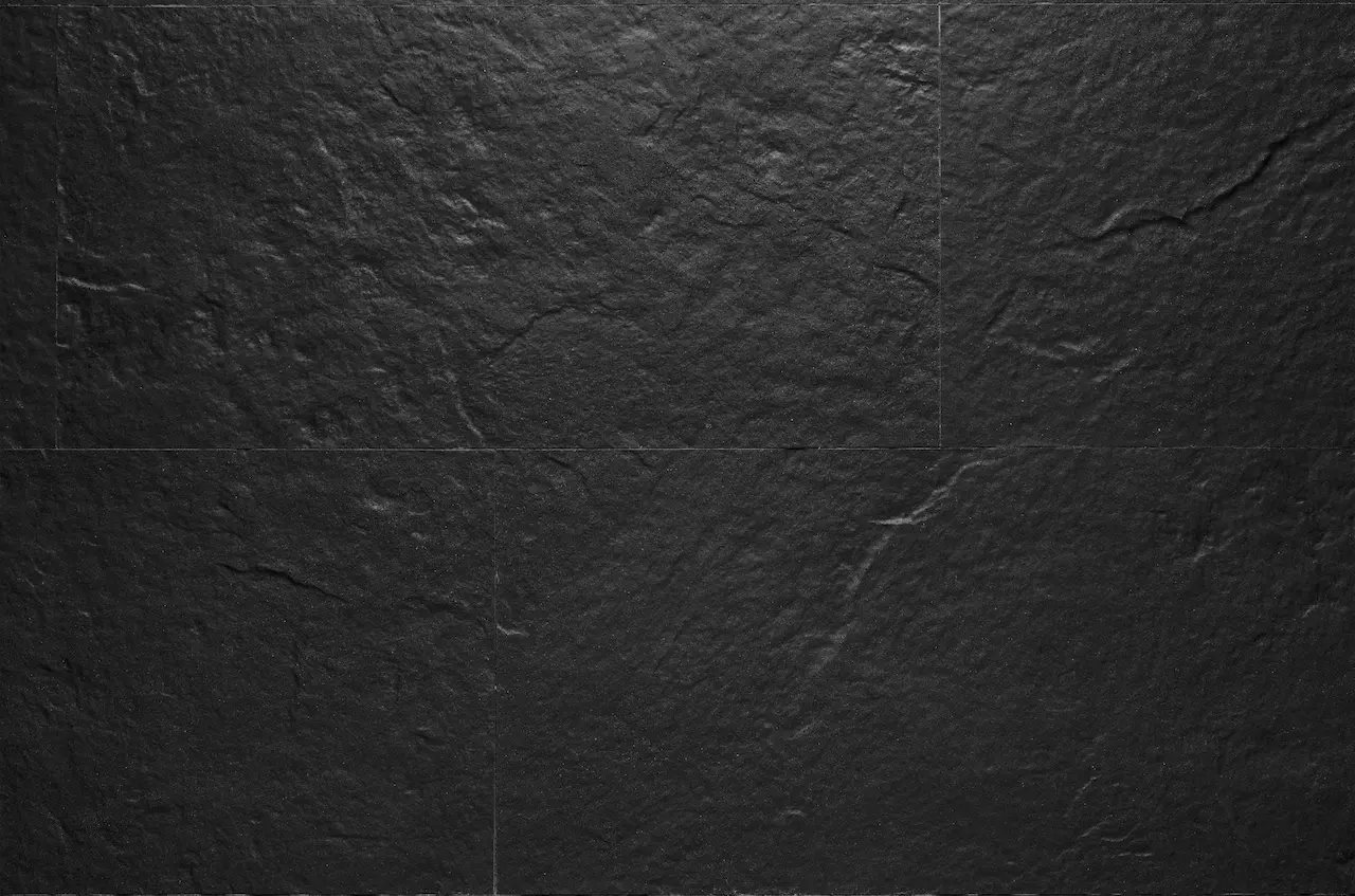 Near-black R09 Volcanic Anthracite flexible tile with a pronounced natural stone relief