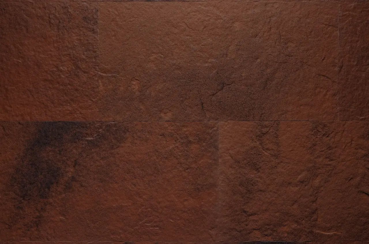 Red-terracotta R10 Loft Red Clay flexible tile with a large relief and dark mottling